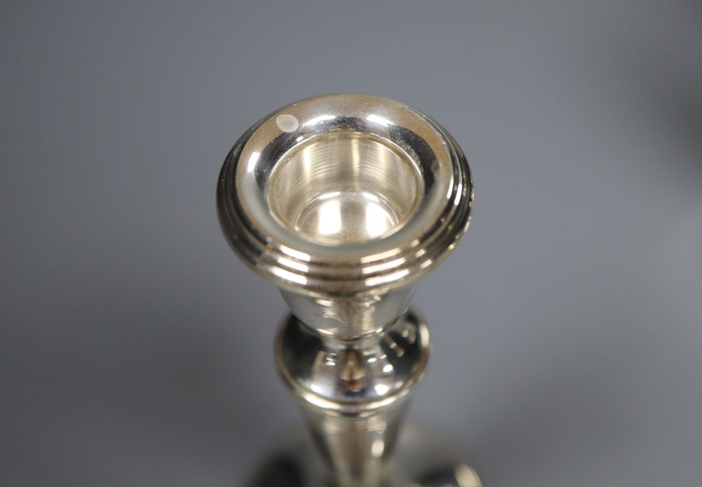 Two pairs of modern silver candlesticks, C. Ltd, Birmingham, 1985 and JM, Birmingham, 1989, 14.5cm, all weighted.